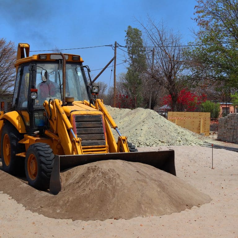 Digger shoveling dirt
